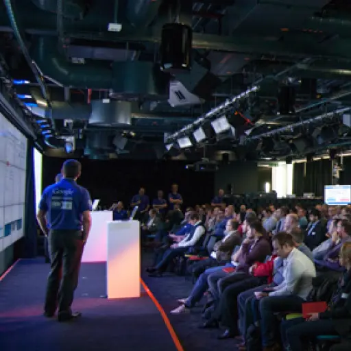 A speaking event with a company representative on stage