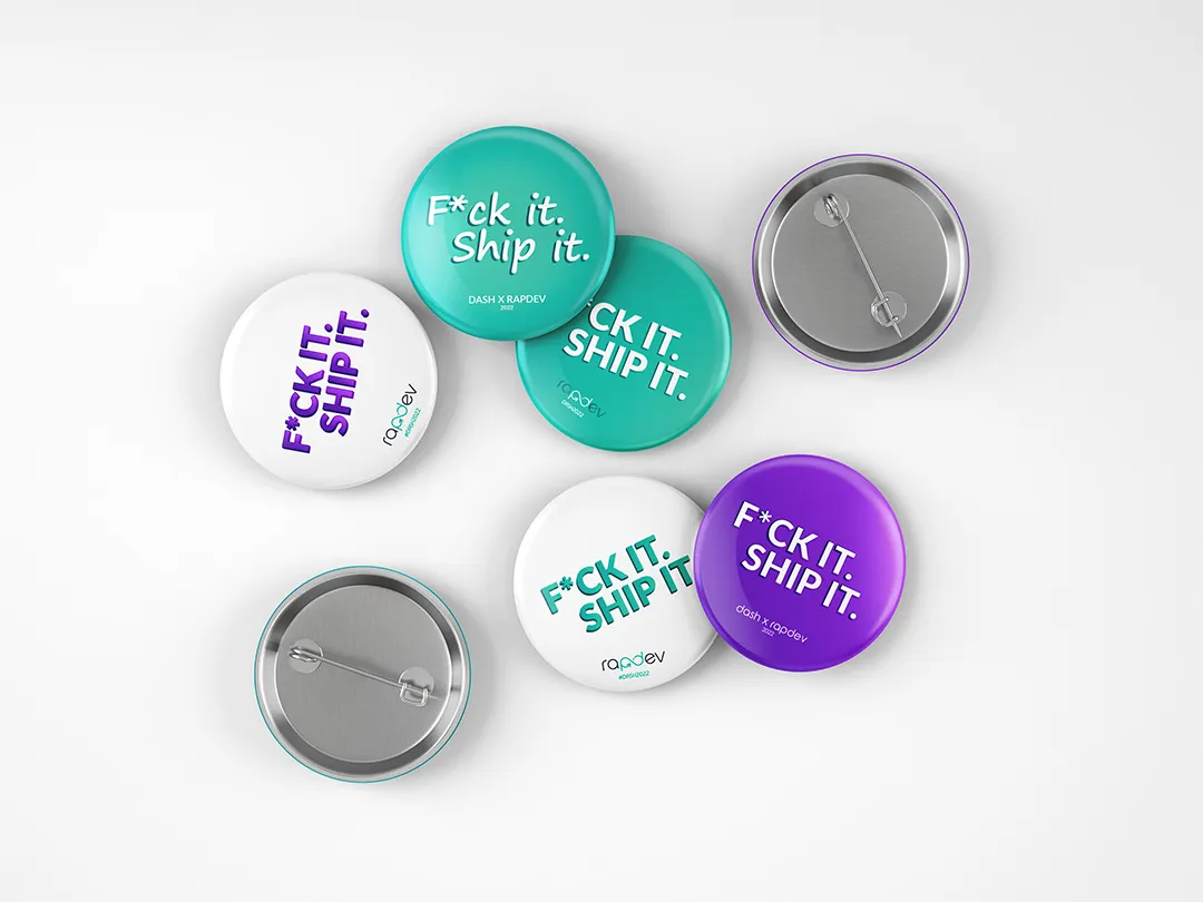 Mockup of RapDev branded enamel pins.