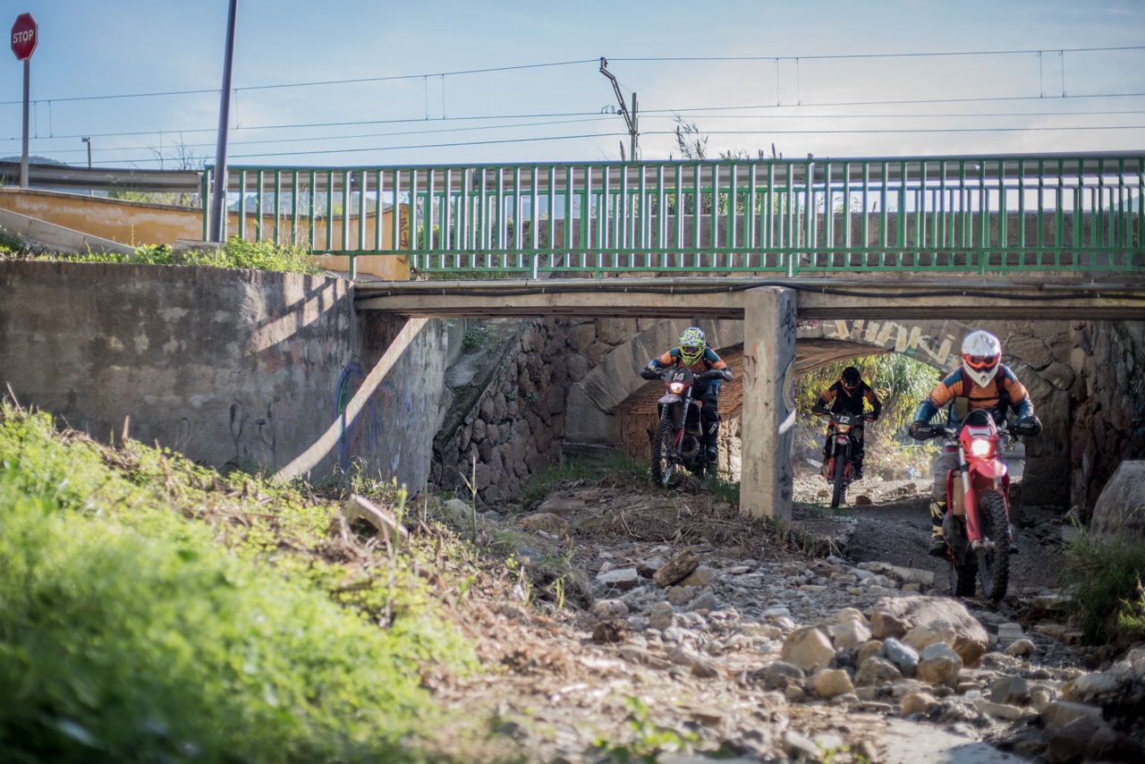 Bikes passing below a bridge