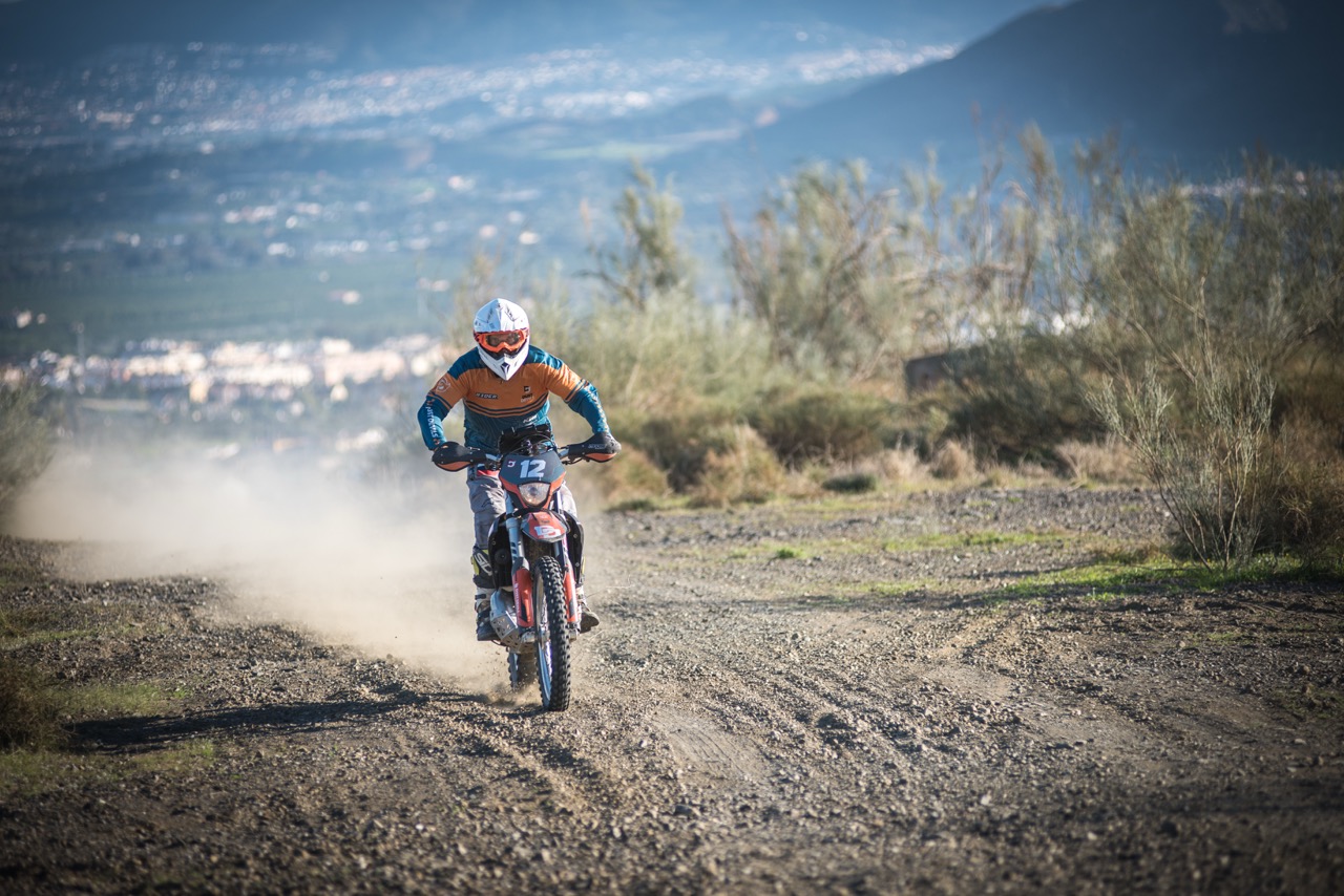 Motorcyle going fast on offroad course