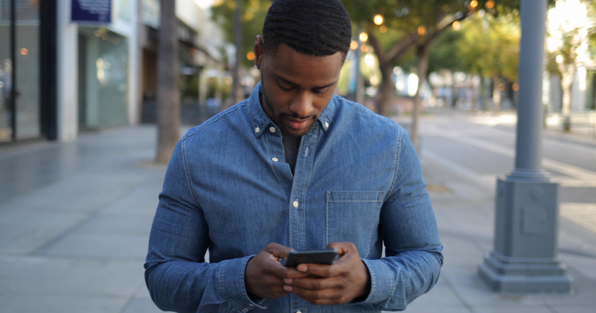 Concerned Crypto wallet holder looking at wallet on smartphone.