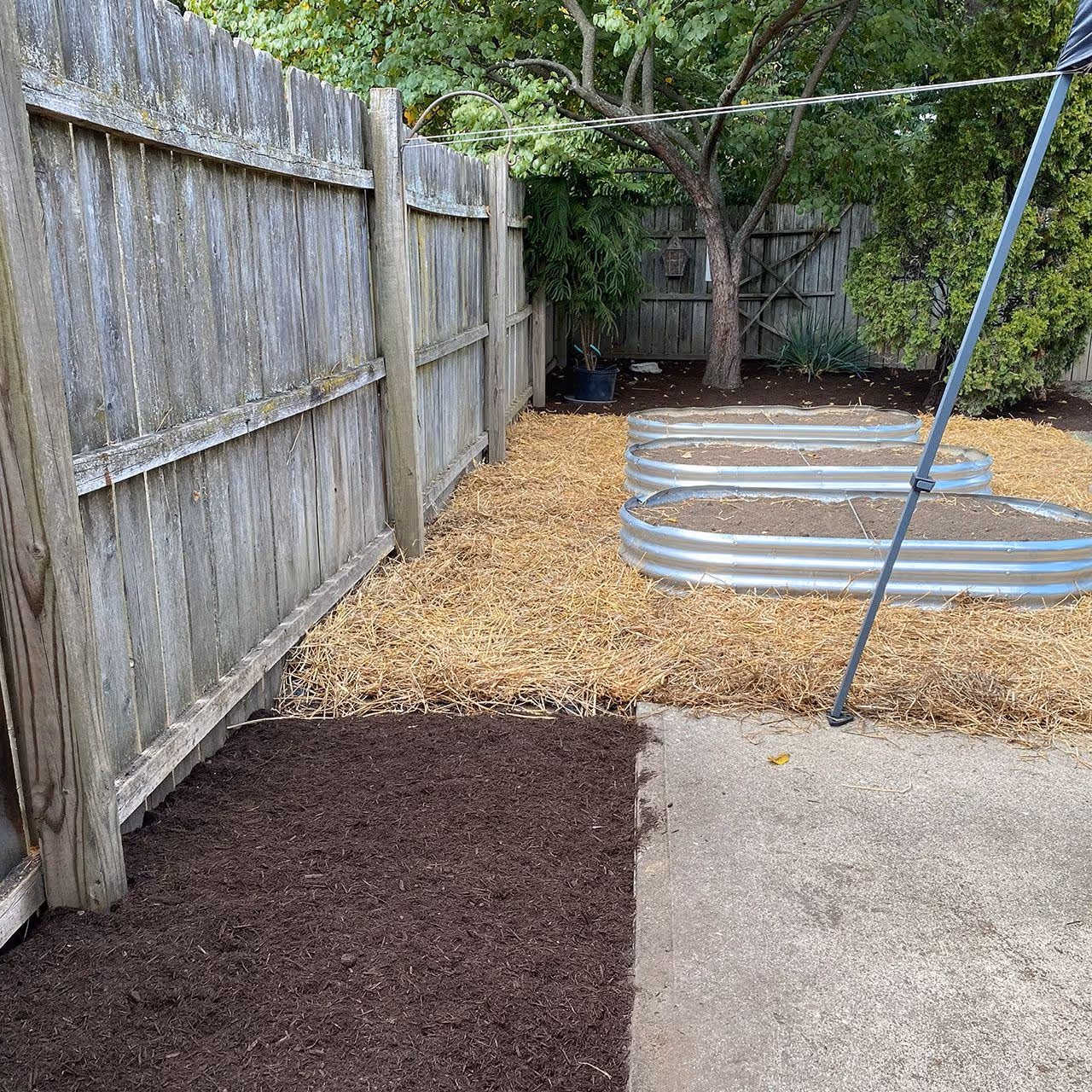Property upgrade featuring new mulch and landscape edging