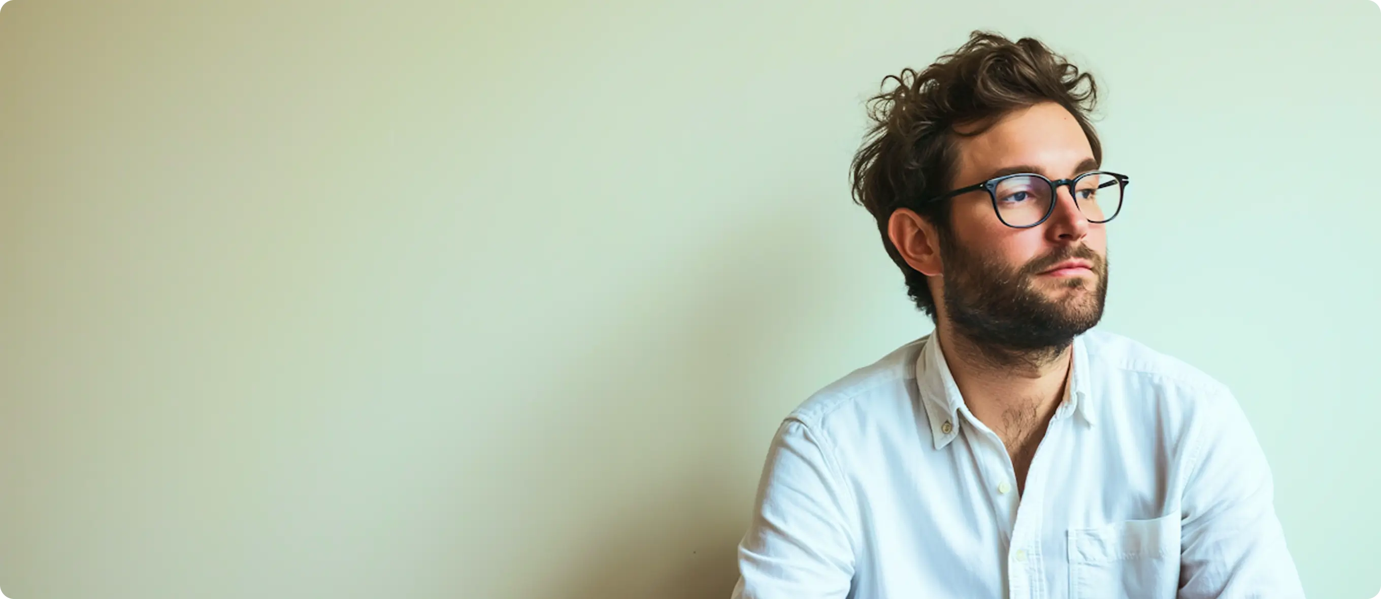 Website homepage featuring a man in a dark suit, the large text 'Lukes', navigation menu, client and engagement stats, and a product designer bio with a Learn More button.