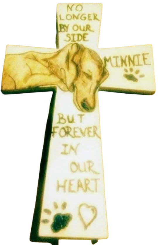 Cross with sleeping dog illustration and text: No longer by our side but forever in our heart, Minnie.