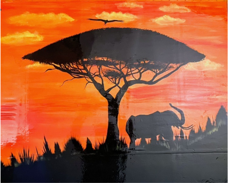 Black silhouette of an elephant and a flat-topped tree against a vibrant orange sunset sky.
