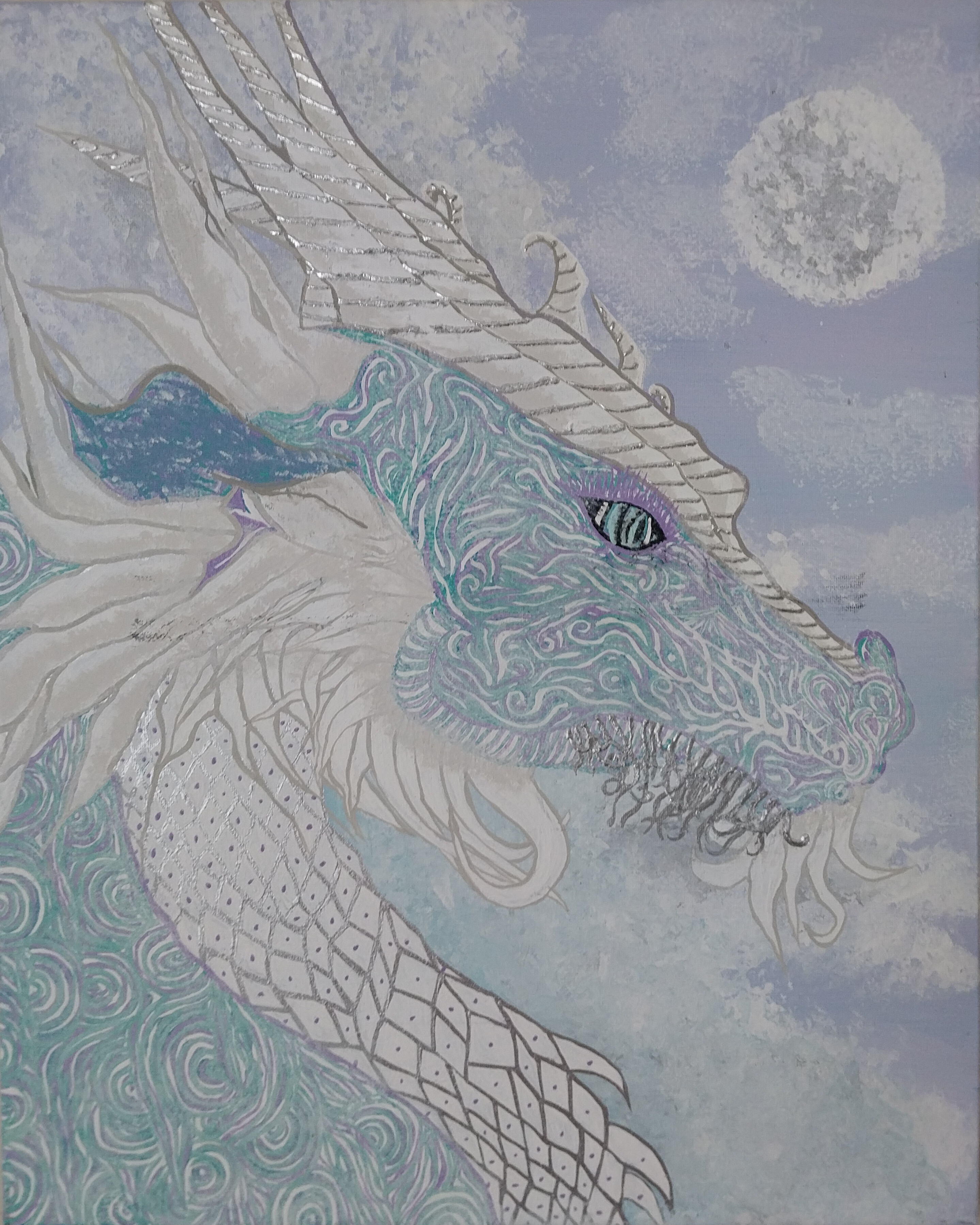 Artistic blue and white dragon head with intricate patterns looking toward a full moon in a cloudy sky.