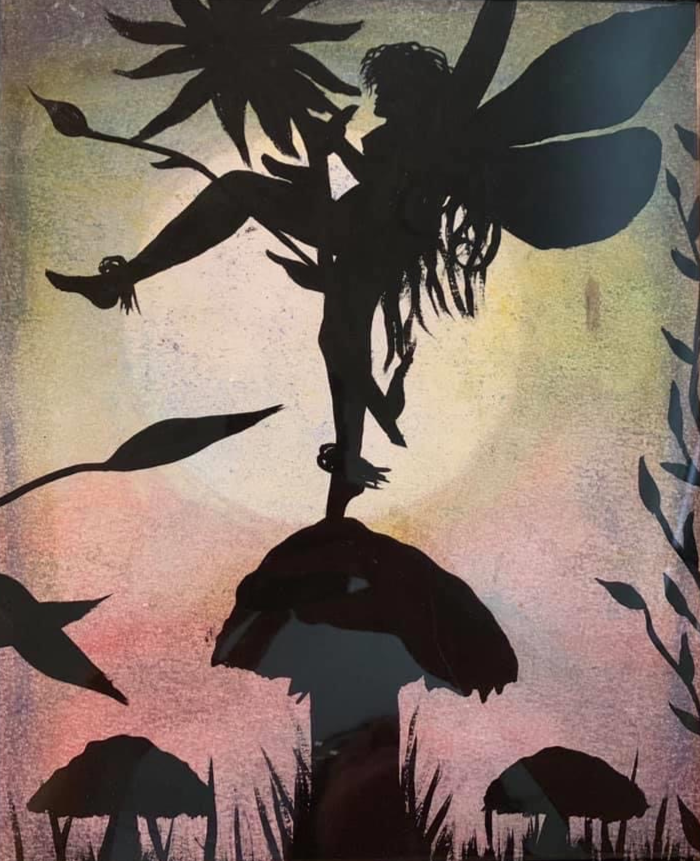 Silhouette of a fairy balancing on one leg atop a large mushroom during sunset with surrounding plants.