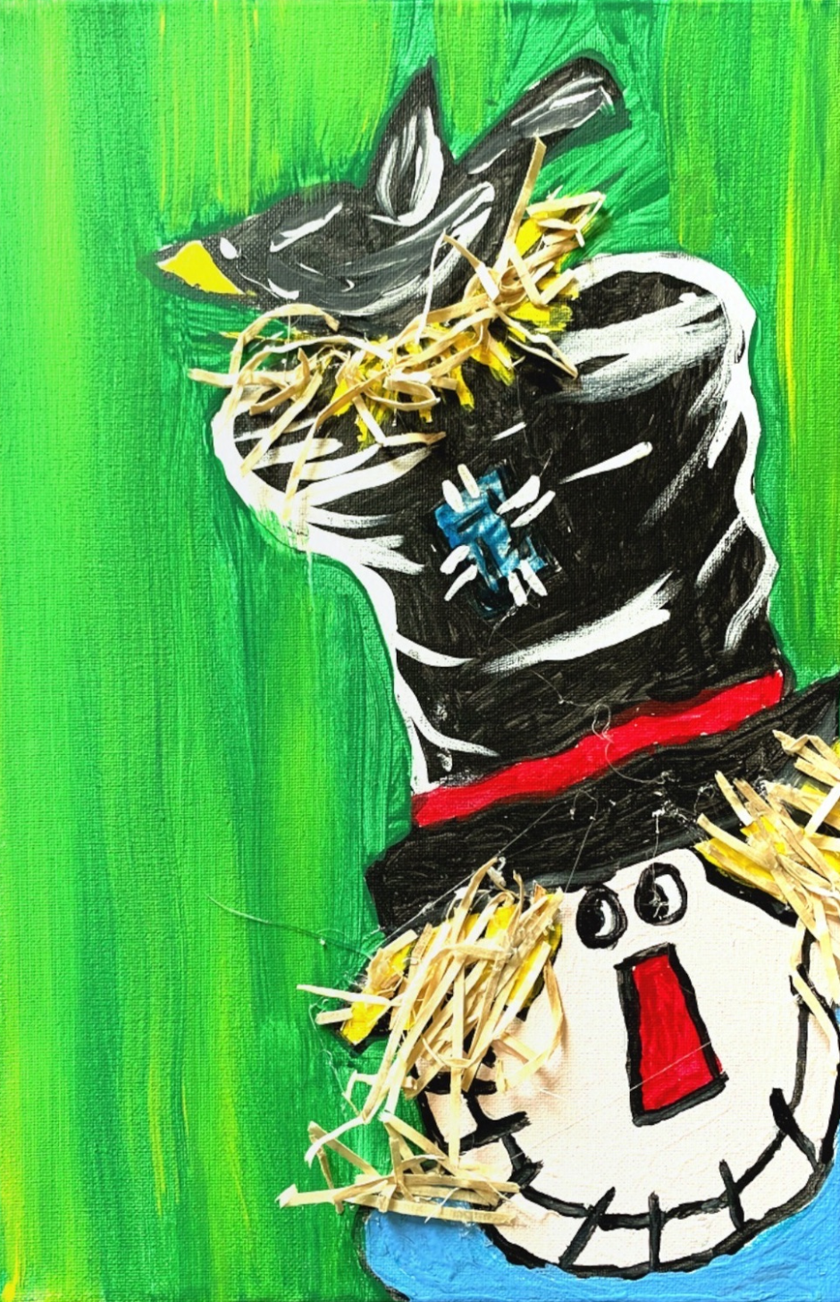 Colorful scarecrow painting with a black hat, red patch, yellow straw hair, and a blue bird on the hat.