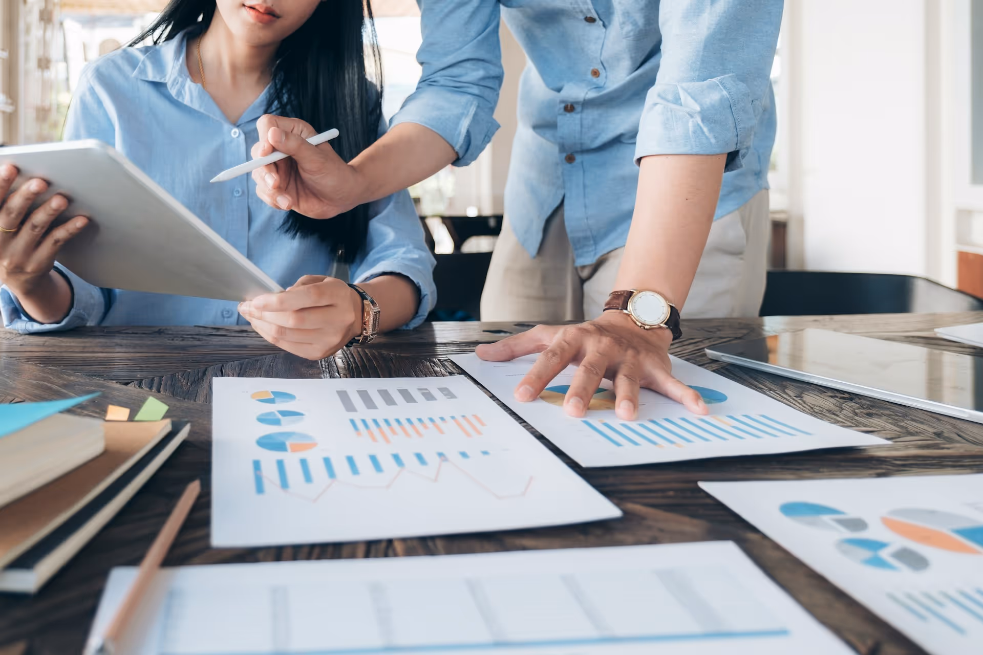 Team reviewing performance charts during strategic meeting.