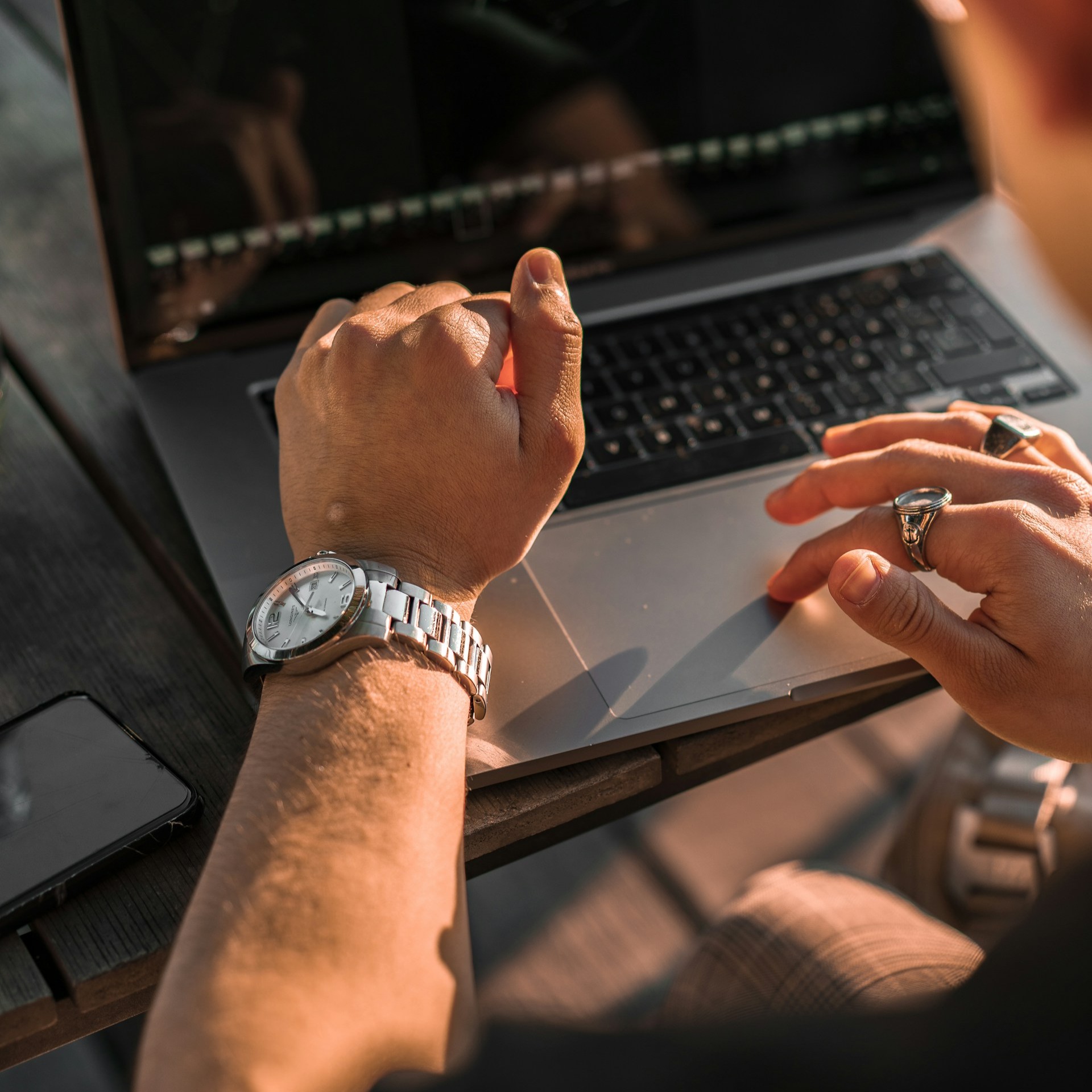 Hands interacting with tablet during collaborative discussion.