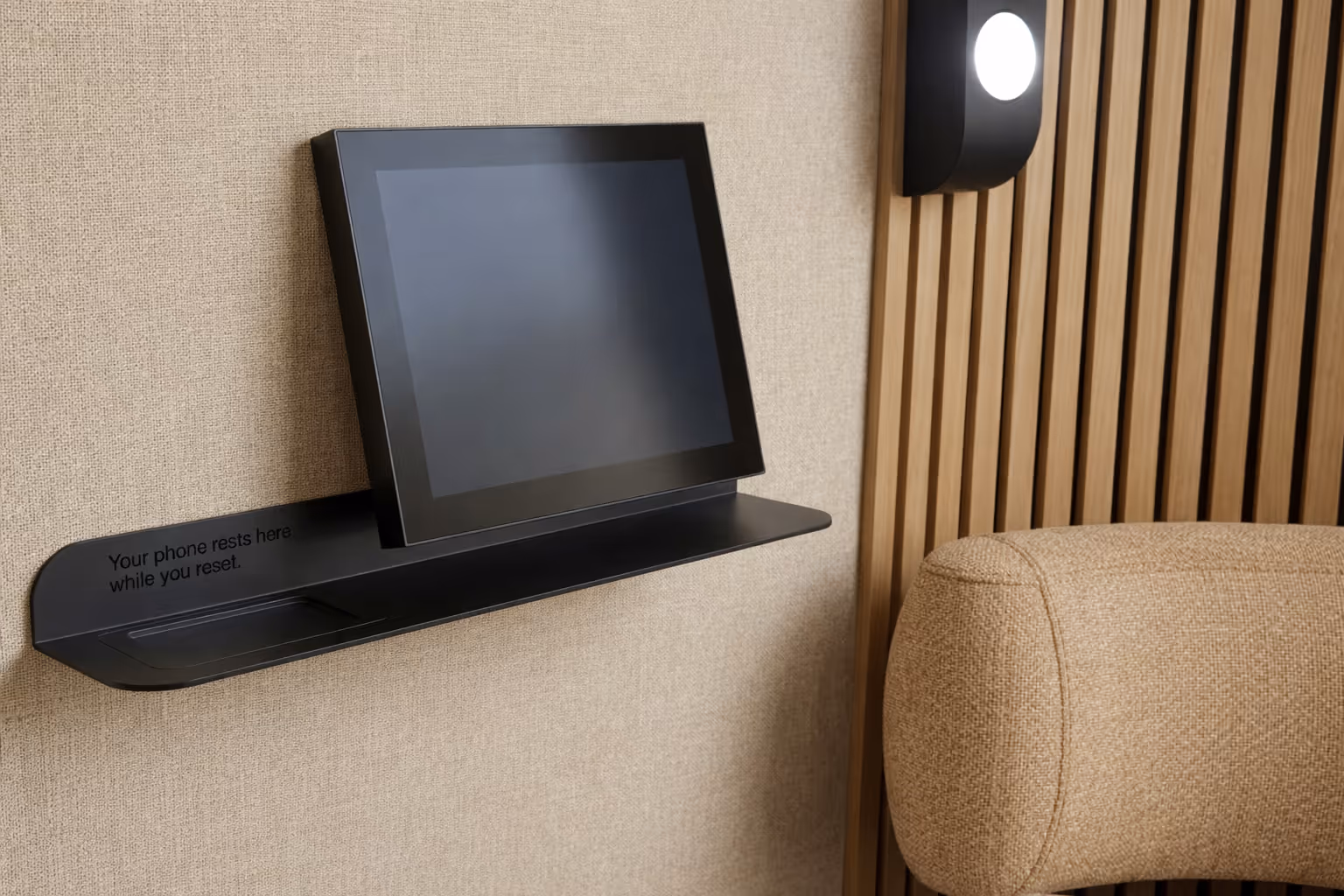 Tablet interface inside Re.Mode reset pod used to start guided reset sessions.