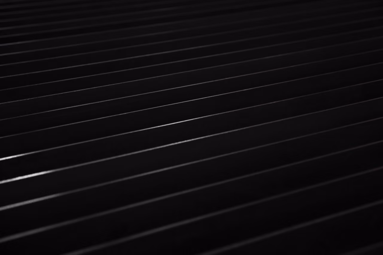 Close-up of black parallel lines creating an abstract texture pattern.