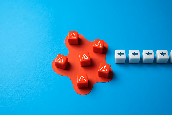 Red warning keycaps grouped on red paint with white arrow keycaps pointing left on blue background.