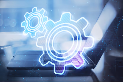 Laptop keyboard with glowing gear icons representing technology and software settings.