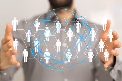 Man holding a digital network of connected white male and female icons representing social connections.