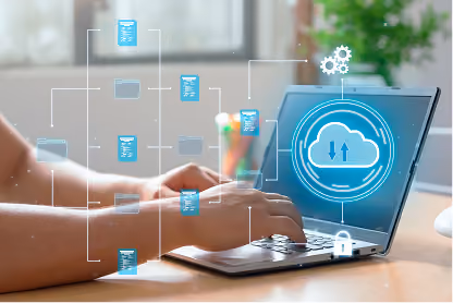 Hands typing on laptop with digital cloud storage icons and file folders floating above keyboard.