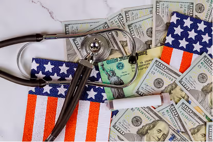 Stethoscope and cigarette on US flag pattern over scattered US dollar bills symbolizing healthcare and costs.