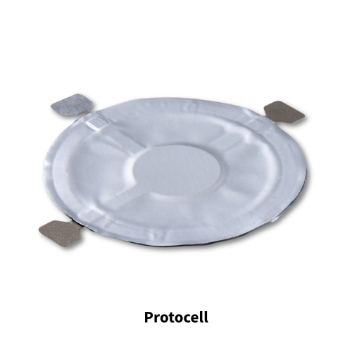 Transparent circular patch with three small offshoots, one tinted light orange.