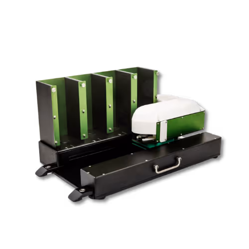 Automated laboratory autoloader device with four vertical green and black slots for holding samples and a white and green mechanical arm on a black base with a handle.