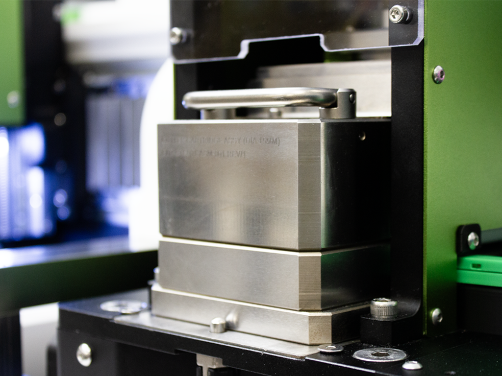 Close-up of an electrode preparation machine cutting die.