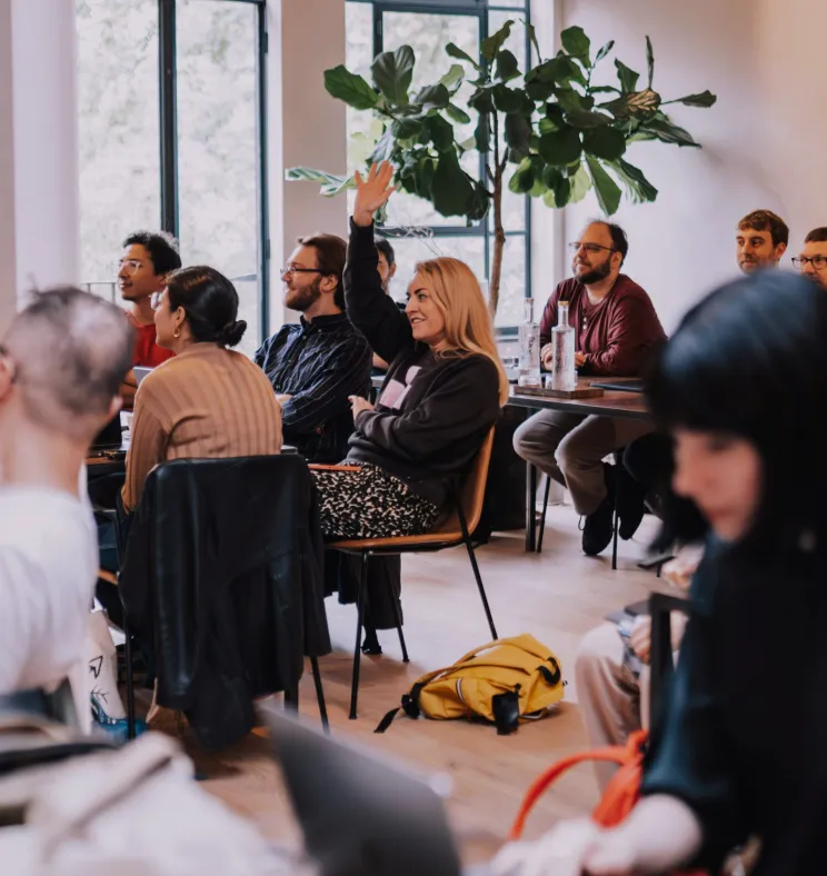 People attending a workshop or meeting in a modern room