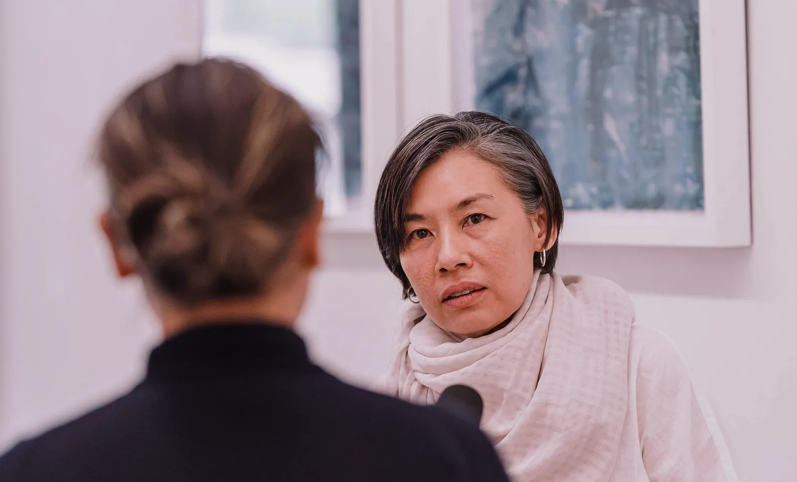 Woman speaking during an interview or formal discussion