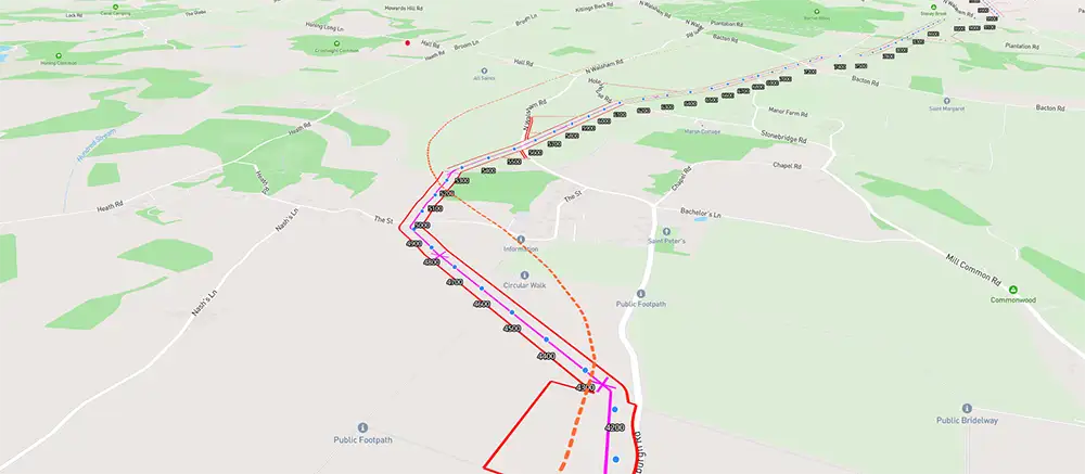 Map with roads, public footpaths, and colored lines marking routes.