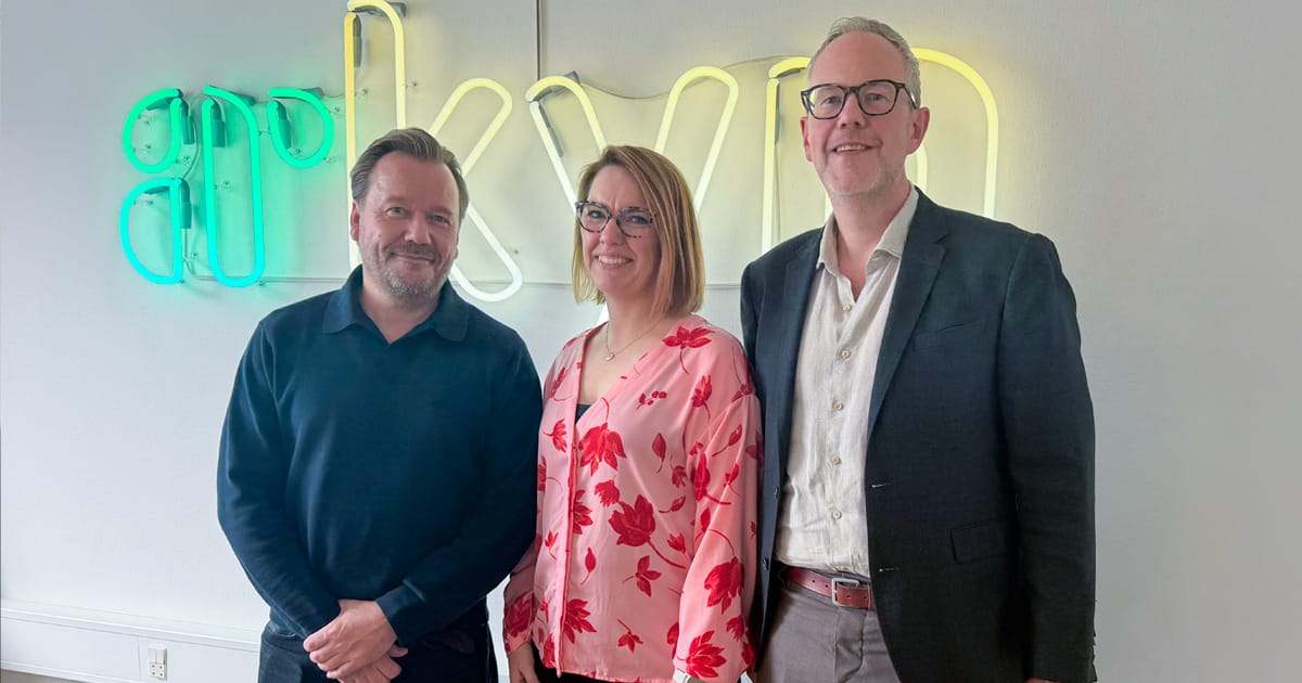 Representatives of Arkyn and SQL Systems standing together to mark their system integrator partnership.