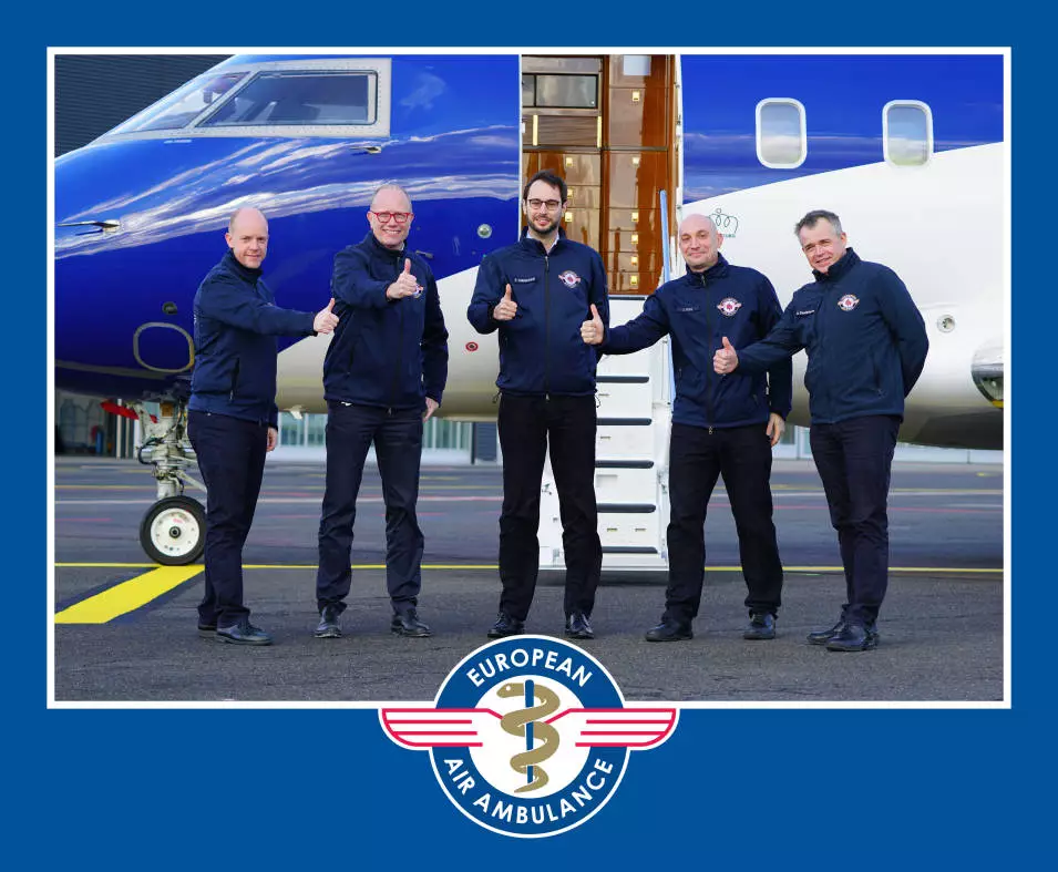 European Air Ambulance crew standing in front of an air ambulance aircraft during a mission preparation.