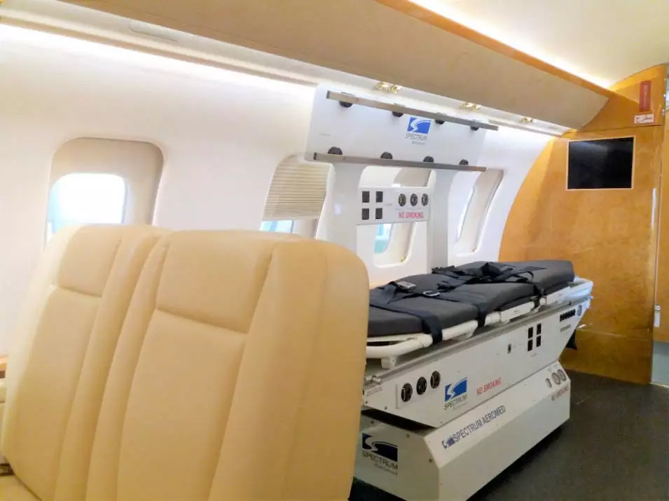 Interior of a European Air Ambulance jet configured with stretcher and medical equipment for patient transport.