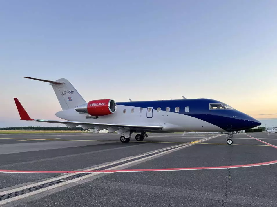 European Air Ambulance Challenger aircraft on the airport apron at sunset prepared for an aeromedical mission.