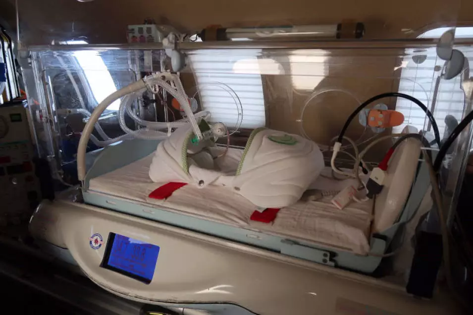 Neonatal transport incubator installed in a European Air Ambulance aircraft for safe transport of premature babies.