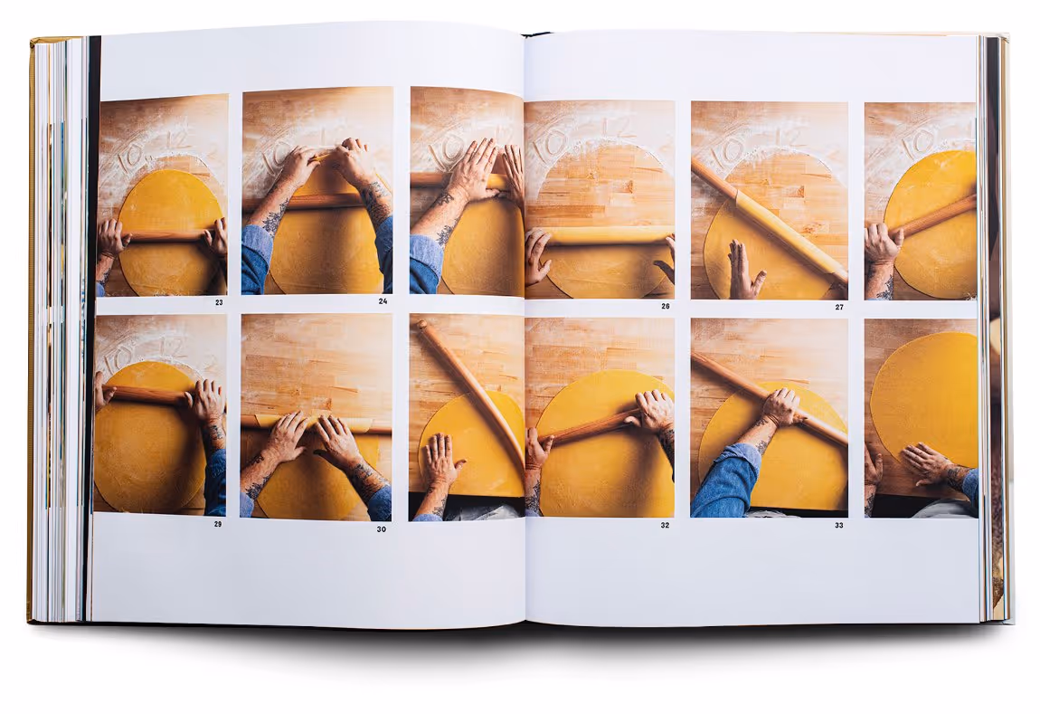 Open book showing step-by-step photos of hands rolling out dough with a rolling pin on a wooden surface dusted with flour.