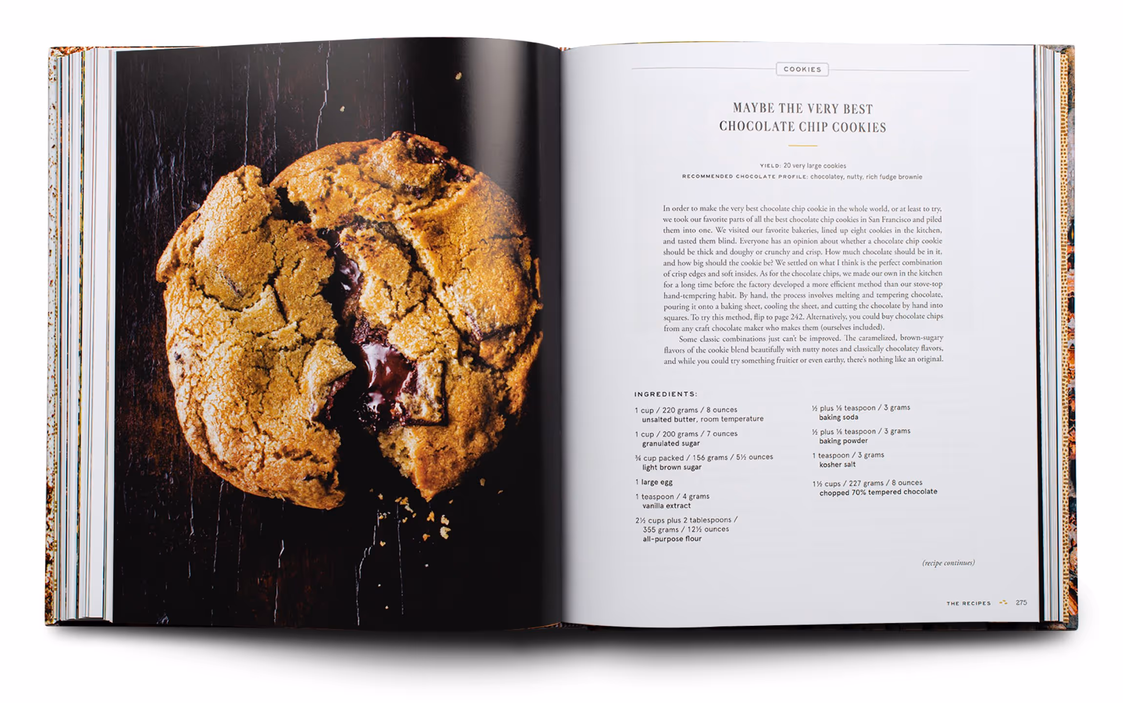 Open cookbook showing a close-up photo of a chocolate chip cookie on the left page and a recipe titled 'Maybe the Very Best Chocolate Chip Cookies' with ingredients and instructions on the right page.