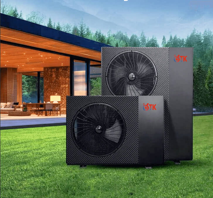 Two TK heat pumps in front of a luxury cabin