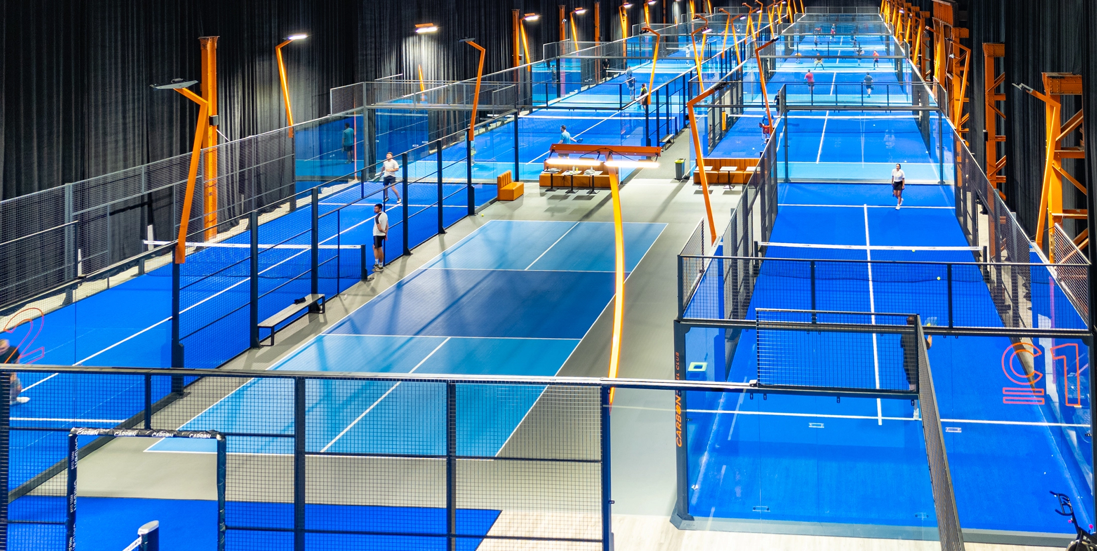 An image of the Carbon Padel development in Manchester which has multiple FULL PANORAMIC courts installed