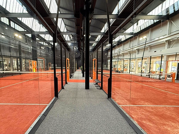 Photo of two installed PANORAMIC courts as part of a Padel development