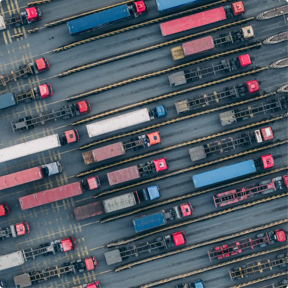 aerial view of trucks entering customs clearance terminal