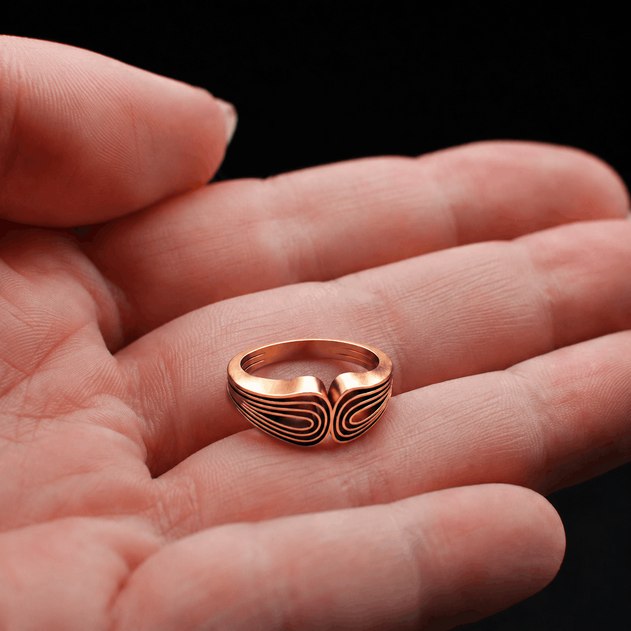 Layrium jewelry Spline Brass Ring in woman hand