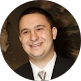 Smiling IT professional in business attire representing Point MSP managed services team in New York City