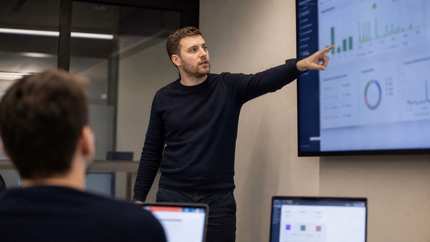 PRESENTATION SCREEN An IT professional one person standing beside a large wa