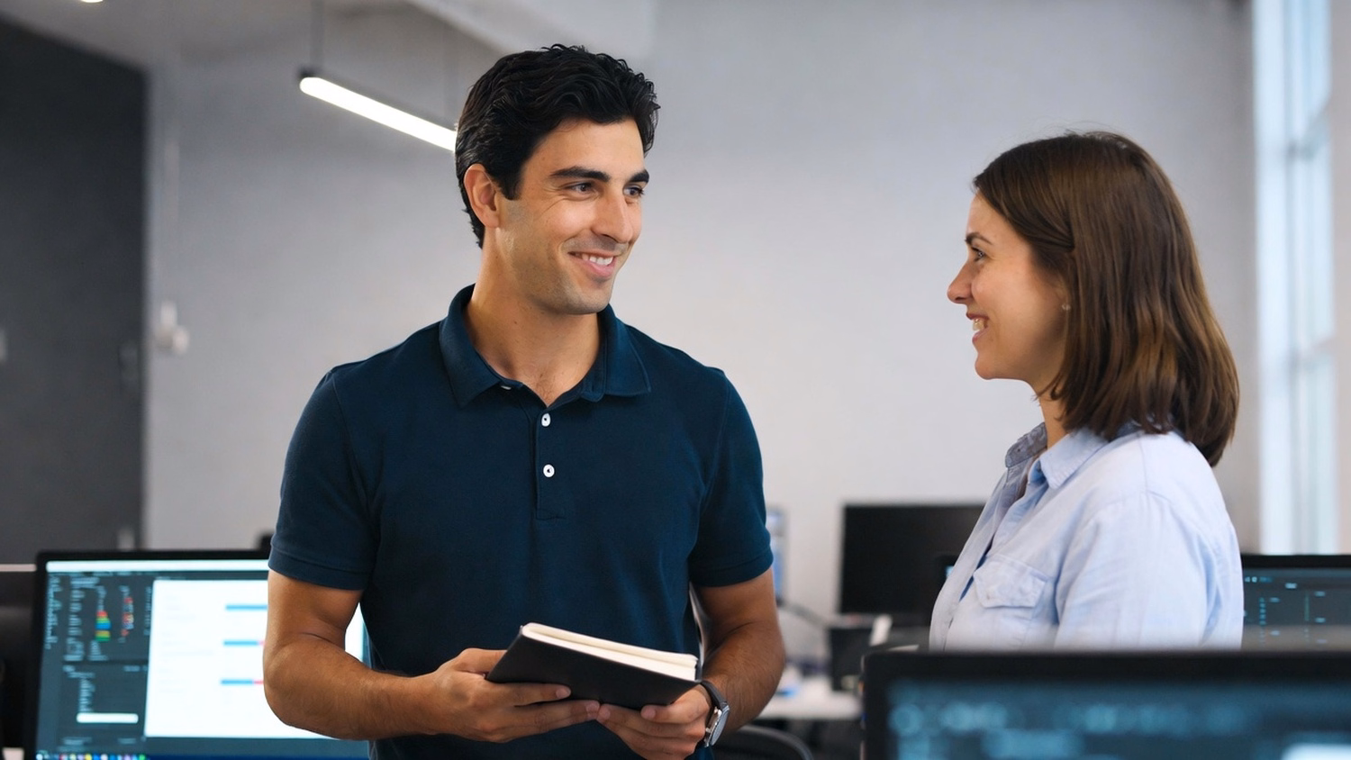 Consultants discuss IT strategy in breakroom nook