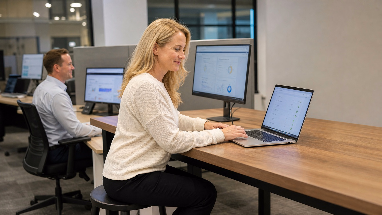 Woman at bench desk reviews iPhone continuity features 65