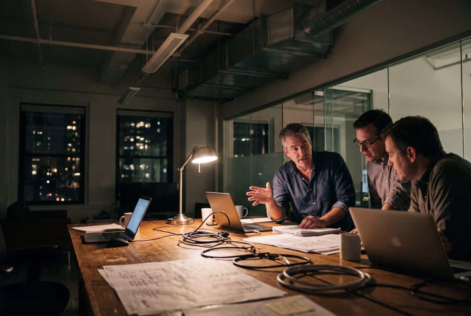 Infrastructure consultants discussing IT modernization at office table