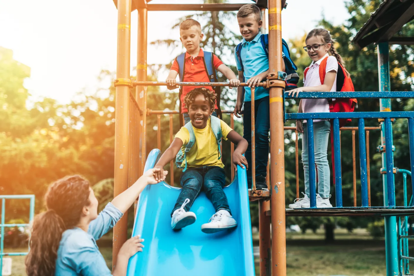 kids on playground with slide stock image