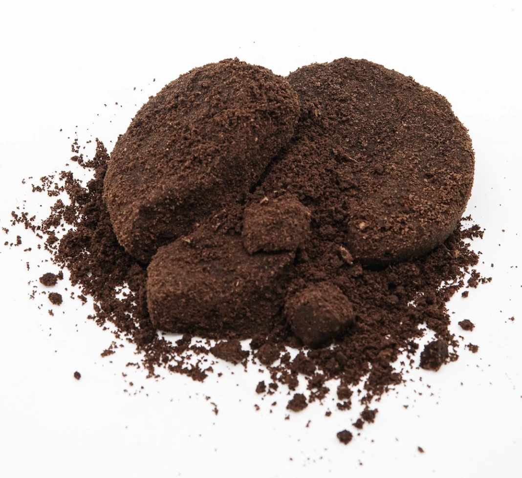 Close-up of a round pile of finely ground coffee.