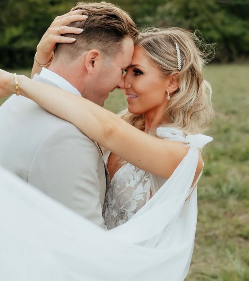 outdoor bride with botox on her wedding day with groom