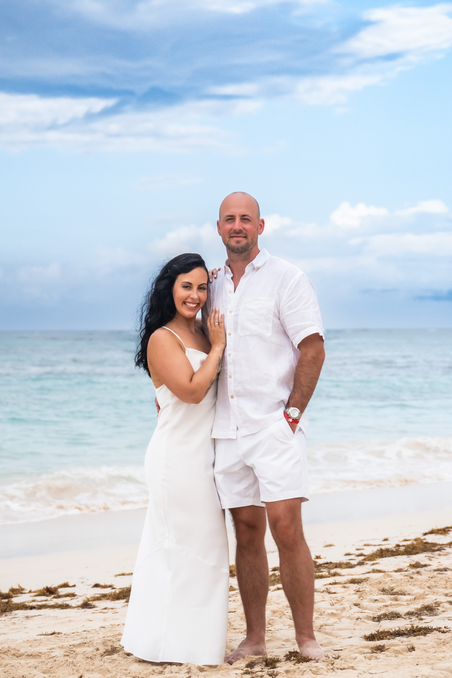 beachy bride with botox standing with groom