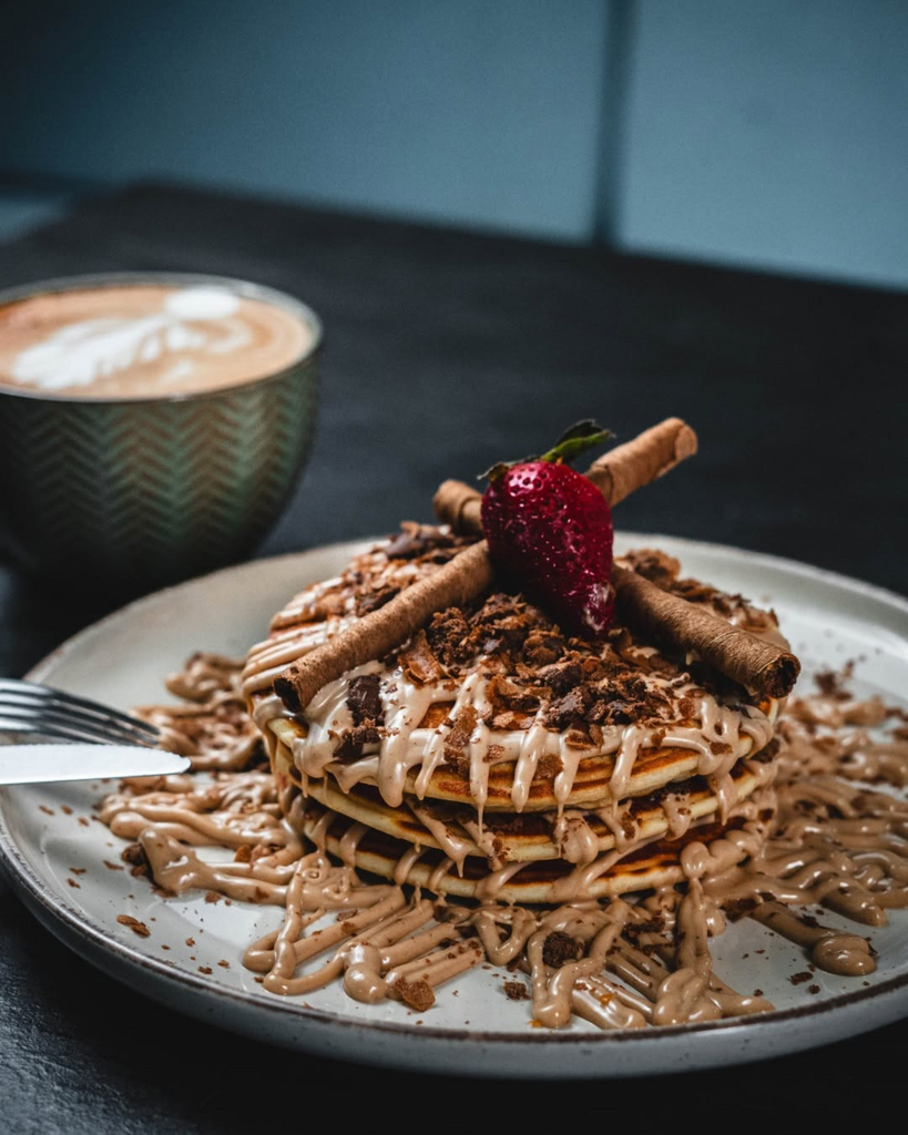 Skqutz logo with stylized tree and lettering.