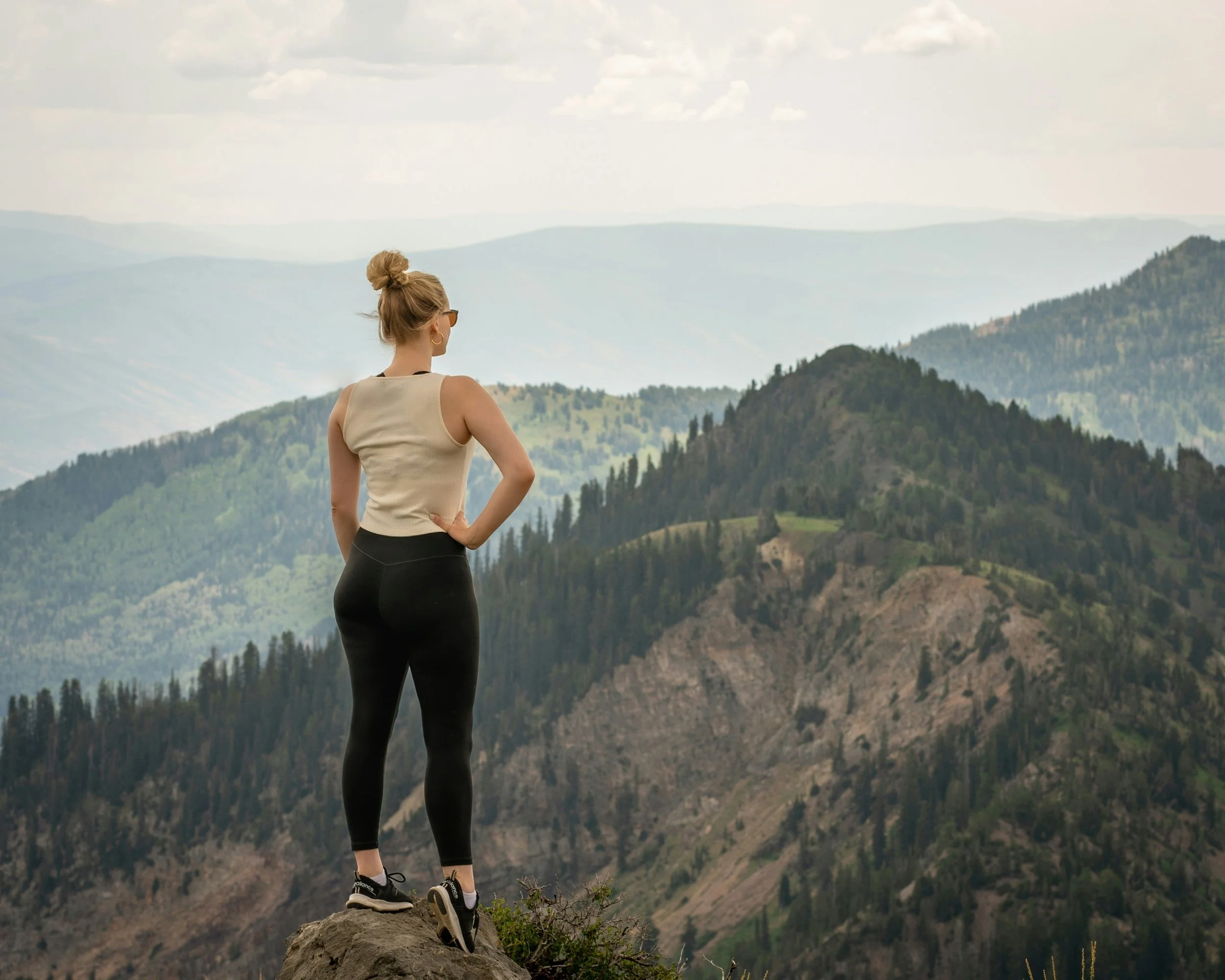 Woman on mountain looking at the view